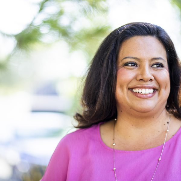 Portrait of a young hispanic woman in the park.