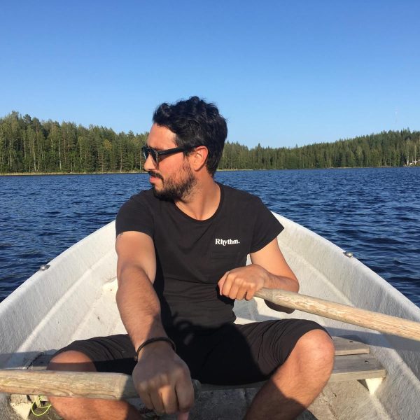 Stefano in a rowboat on a lake in Finland.